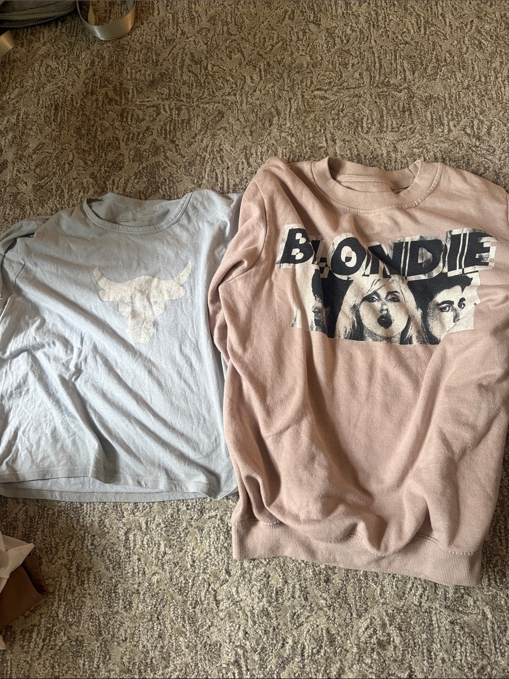 UA shirt and blonde sweatshirt